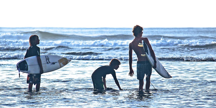 A group of children going for a surf and enjoying the water sports in Bali