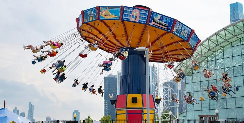 People enjoying at swing carousel with scenic views - theme parks in Malaysia