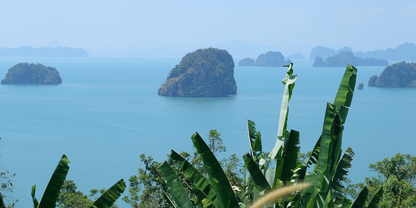 One of the best things to do in Thailand in November is scenic limestone cliffs and emerald waters.