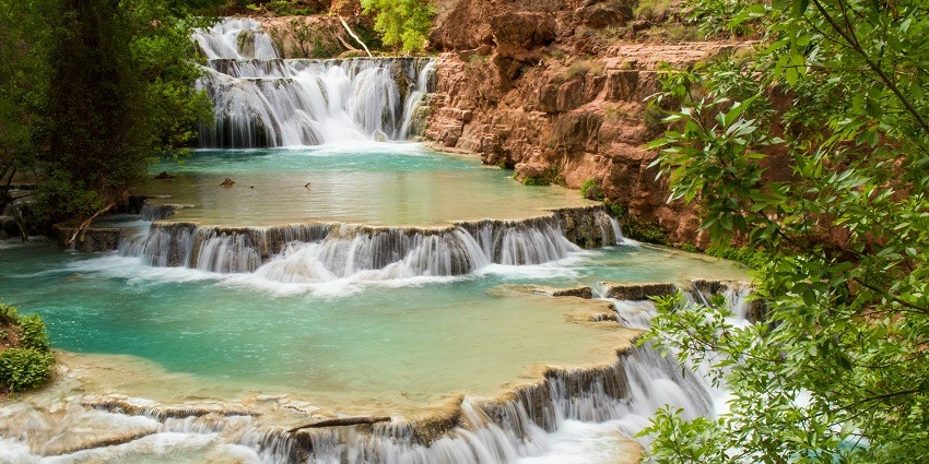 A mesmerising view of glistening waters pouring down the cliffs at Talakona Waterfalls.
