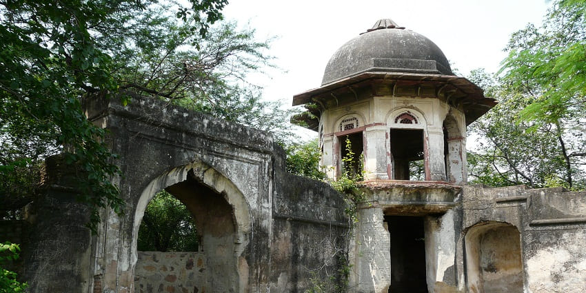 Pavilion at Talkatora Gardens with arched design, open lawn, and landscaped greenery.