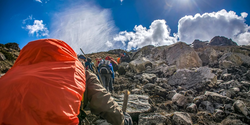 A scenic view of people hiking through the majestic rocks and stairs in Talle Valley.