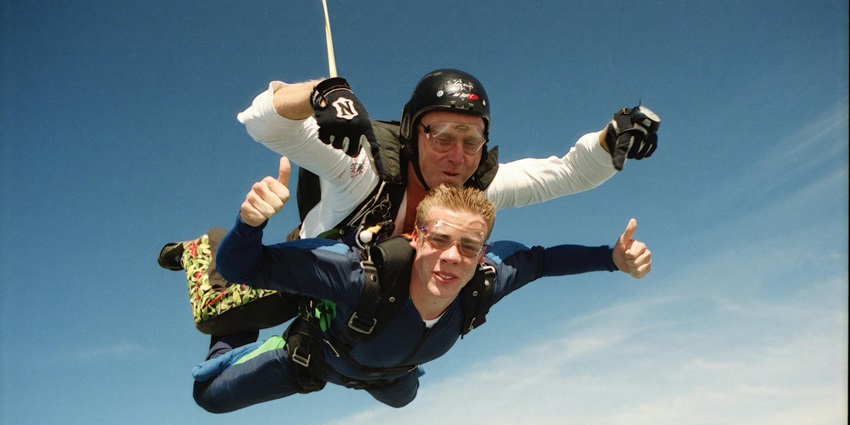Skydiving, Instructor and the host jumping together from the plane–skydiving Singapore