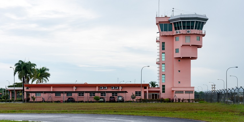 Tawau Airport, showcasing a modern terminal and the surrounding scenic landscape.