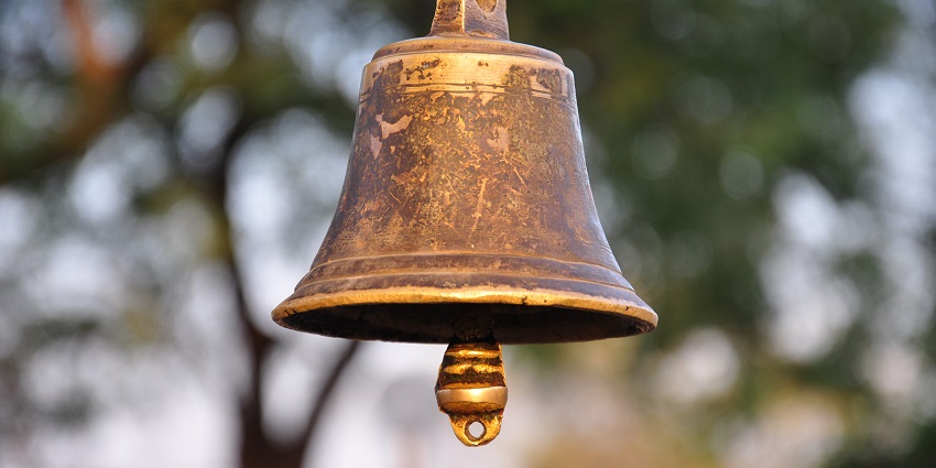 A traditional temple bell hanging and ready to be rung - Shri Govind ji temple in Manipur.