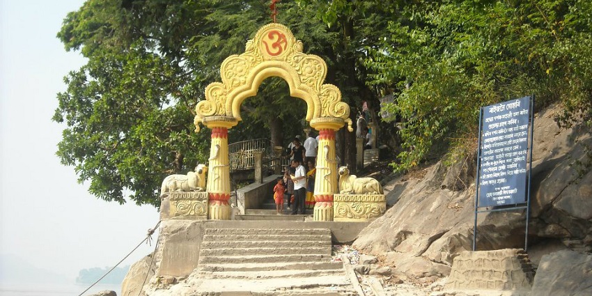 Image of picturesque view of temple in Umananda, near Brahmaputra river and greenery.