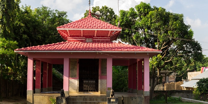 Beautiful Image of a Bageshwori Temple surrounded by the lush dense forest amidst the hill