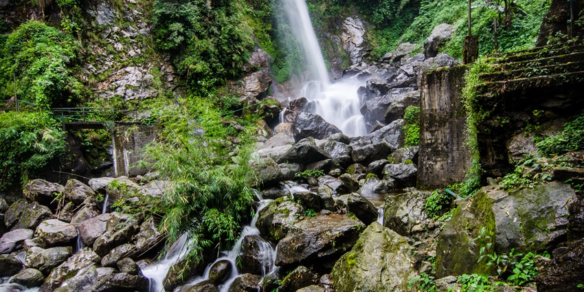 An image of a serene waterfall resembling the vibes of the beautiful Temurun Waterfall
