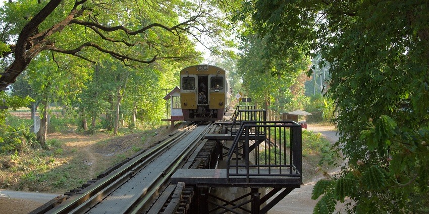 Scenic image a train track and boggy somewhere in the beautiful green city of the Thailand