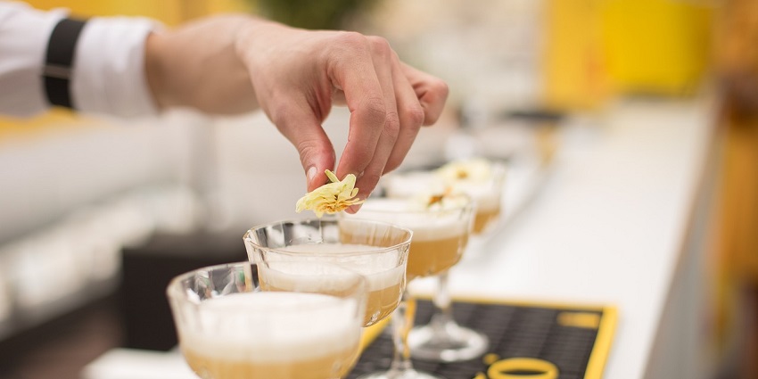A picture of a bartender preparing cocktails at a bar in Trivandrum