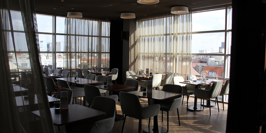 Vienna Sky Bar with rooftop seating, ambient lighting, similar to The Sky Bar, Trivandrum