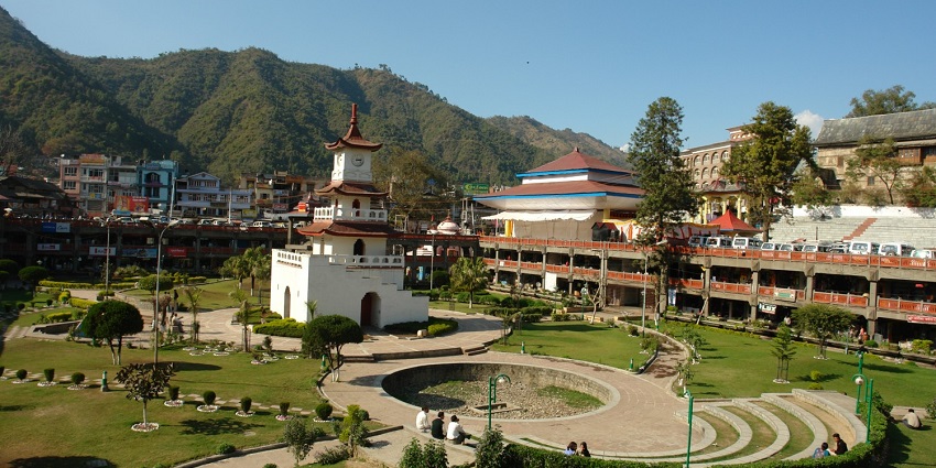 A captivating view of the Sunken Garden with a backdrop of clear skies and mountains.