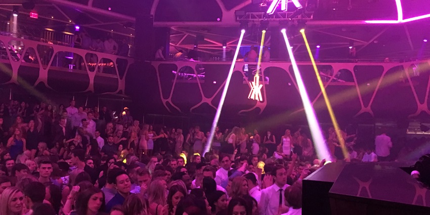 People enjoying at a themed nightclub, vibing and dancing