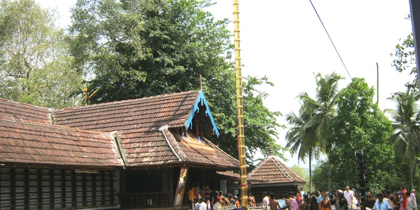 Thirumandhamkunnu Bhagavathy Temple in Kerala, showcasing its traditional Kerala-style architecture atop a hill