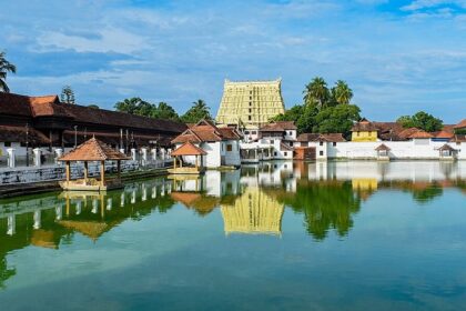 A beautiful lakeside view of a temple in Trivandrum