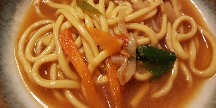 Taste the delicious local dishes like Thukpa, one of the things to do in Gangtok, Sikkim.