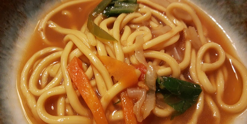 A bowl filled with noodle soup