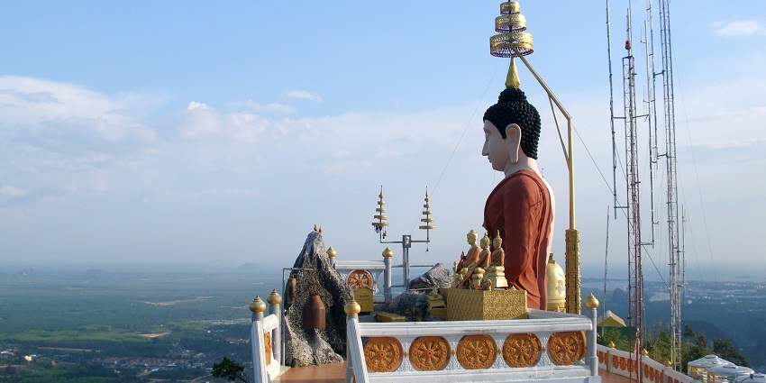 Snapshot of the scenic Buddhist wat overlooking the city from the hill–Thailand Temples