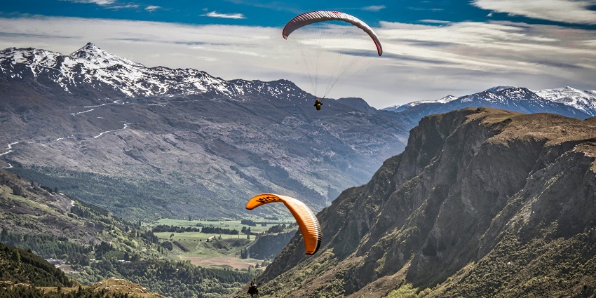 People indulging in this activity and soaring high up in the air amidst the peaks.