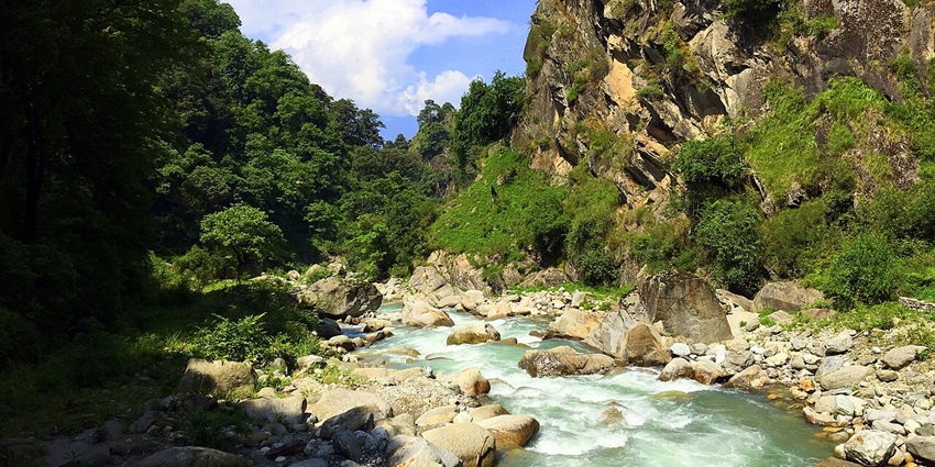 An image of a serene valley in Himachal, known for rivers, trekking, and fishing spots.