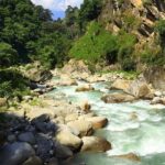 A serene riverside campsite in Tirthan Valley, in the state of Himachal Pradesh, India.