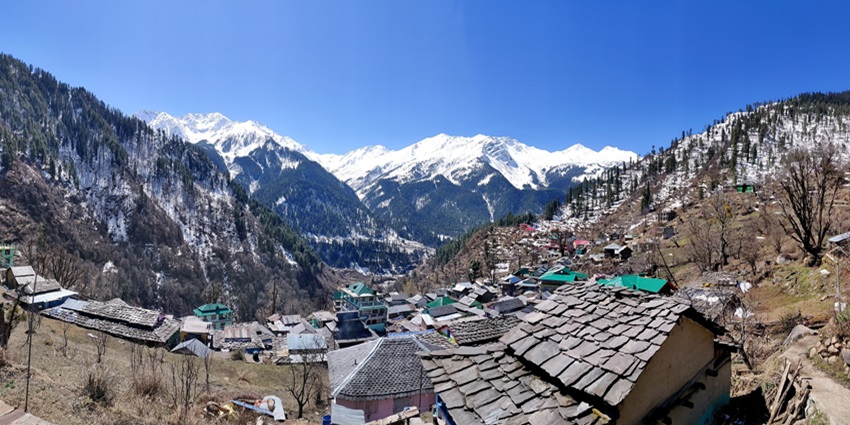 A view of snow-covered mountains that are perched on the Tosh Village, a scenic location.