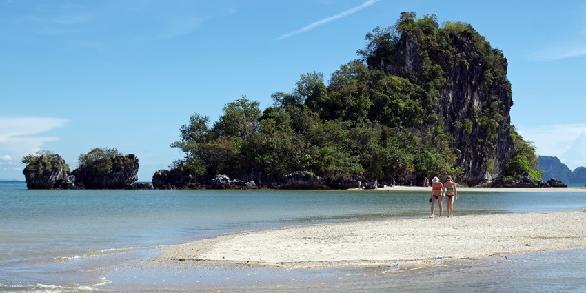 Noppharat Thara Beach with golden sand, clear waters, and a serene, relaxed atmosphere.
