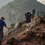 A view of people making their way through the steep slopes relishing the surroundings.