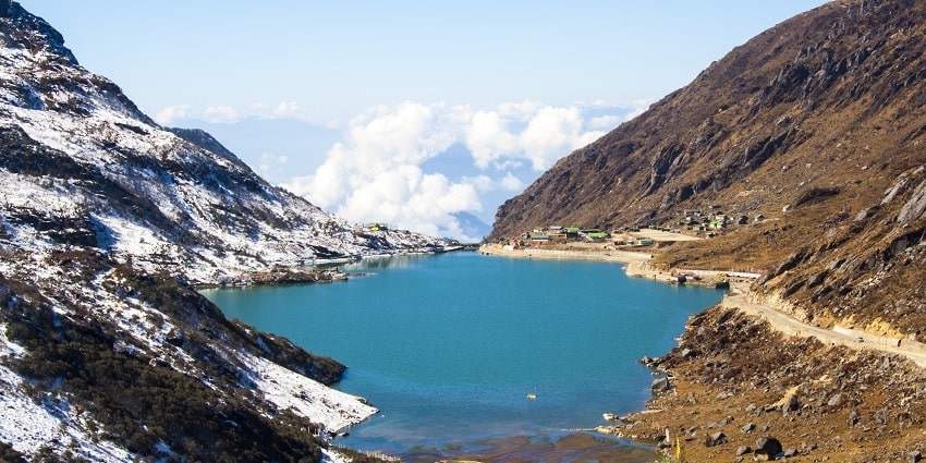 A snow mountain reflecting on a lake’s surface