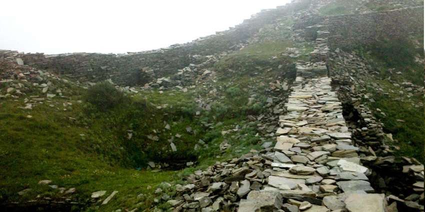This fort offers commanding views of the surroundings, including lush valleys and distant peaks.