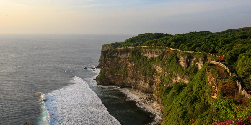 Uluwatu Beach is known for its breathtaking views and surf breaks which draws tourists