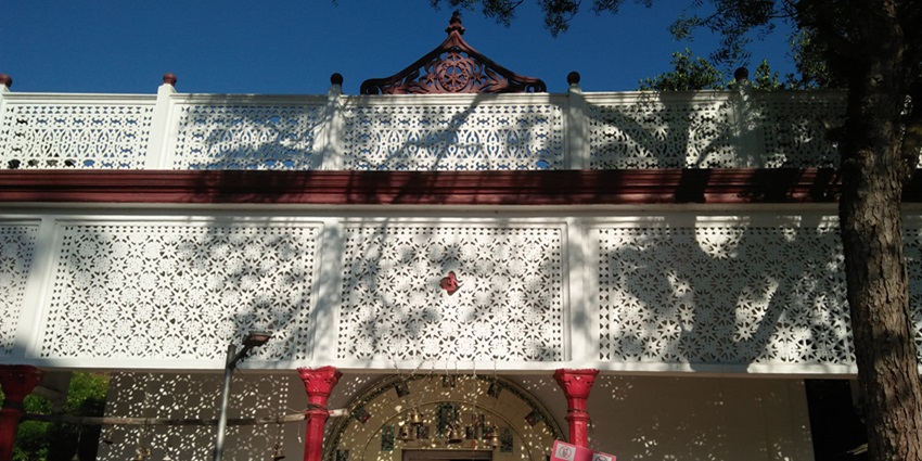 Umananda Temple with intricate architectural details and a serene riverside setting.