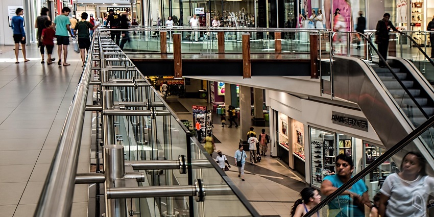 Image of inside the shopping mall escalators - where people are going on the top floor
