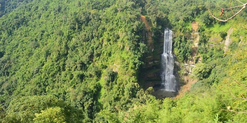 Relax and unwind in the lush green surroundings of Vantawng Falls, a serene spot.