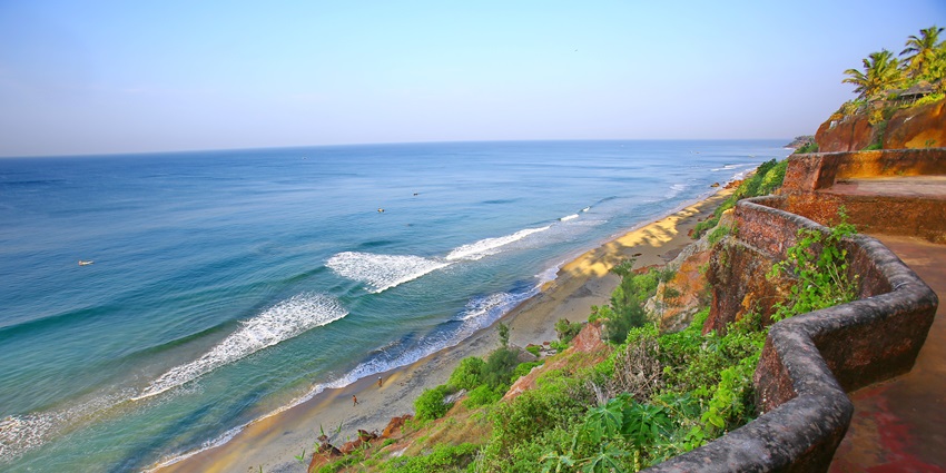 Aerial view of Varkala’s dramatic sea cliff overlooking the Arabian Sea at sunset.