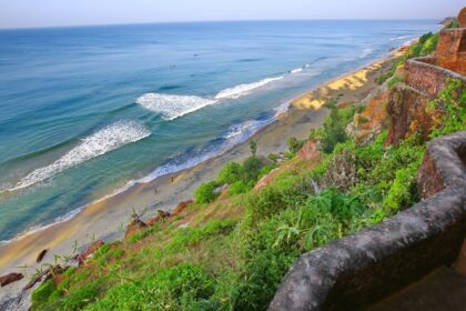 Watching waves crashing the shores of Varkala beach is a must things to do in Kerala.