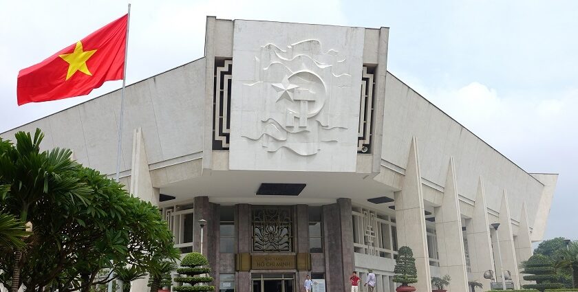 The front view of the museum, a historical marvel, featuring the national flag of Vietnam.