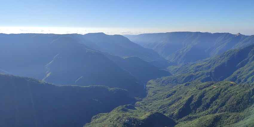 Laitlum Canyon in Shillong offering breathtaking views of rolling hills and deep gorges.