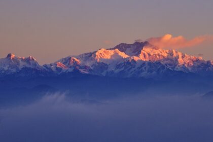 Witness the breathtaking views of the majestic Sandakphu Peak from Tumling, Nepal.