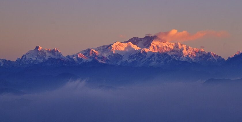 Witness the breathtaking views of the majestic Sandakphu Peak from Tumling, Nepal.