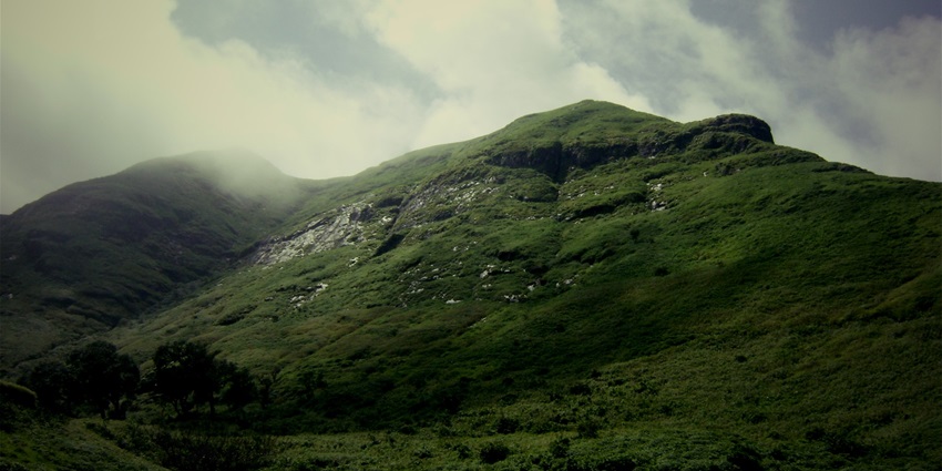 Scenic view of Brahmagiri Peak, showcasing its majestic heights and surrounding landscape.