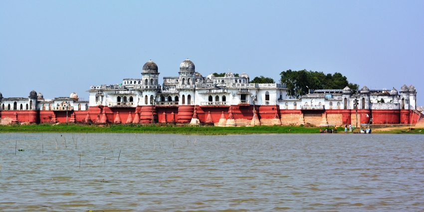 Scenic view of Neermahal, featuring its beautiful façade and surrounding water.