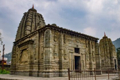 View of Panchvaktra Temple featuring traditional Himachali architecture and nestled by the Beas River.