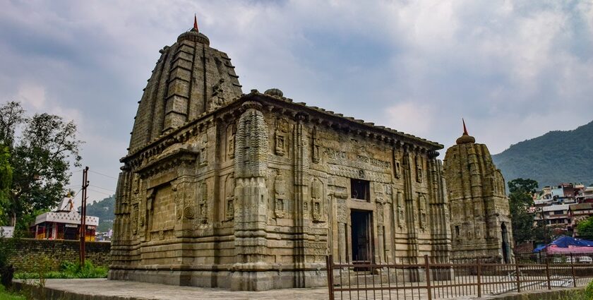 View of Panchvaktra Temple featuring traditional Himachali architecture and nestled by the Beas River.