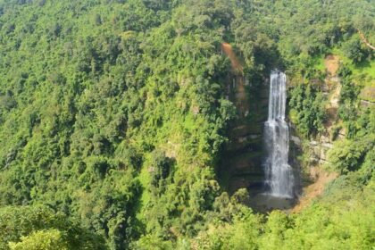 Vantawng Waterfalls cascades down lush green cliffs, creating a stunning natural spectacle.