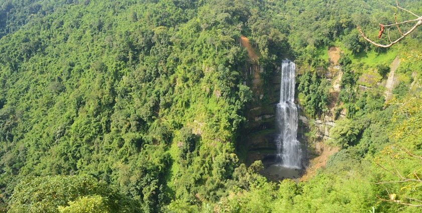 Vantawng Waterfalls cascades down lush green cliffs, creating a stunning natural spectacle.