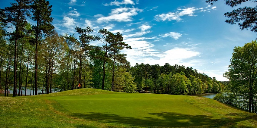 View of Polo Park with well-maintained grounds, lush greenery, and recreational areas.
