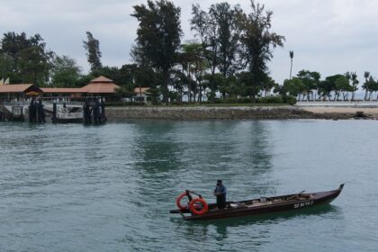 Image of Kusu Island, featuring serene beaches, clear waters, and lush greenery.