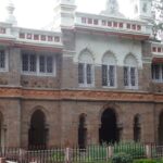 A breathtaking view of a historical monument surrounded by a lawn during the daytime.