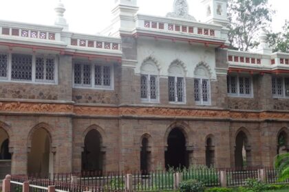 A breathtaking view of a historical monument surrounded by a lawn during the daytime.